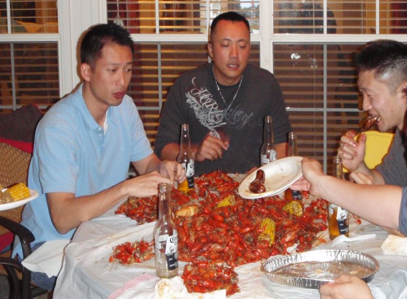 Ben, Lewis and Russ Tong chowing down on crawfish