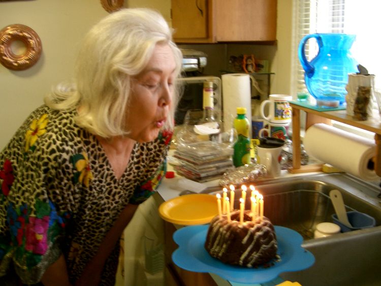 Alice blows out the candles on her birthday cake