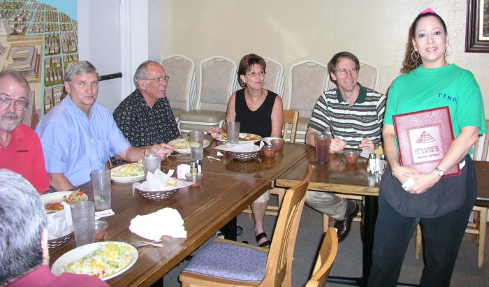 Tash, Marv, George, Mike, Charlotte, and Tim are paying attention to Marilyn