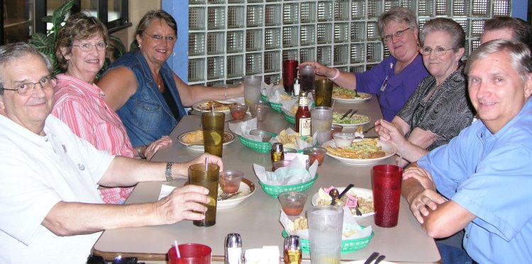 L-R: Dennis Kaplan, Joyce Kaplan, Connie Wallner, Dorothy McGrath, Frances Bradford, and Jack Boling hiding behind George Huling