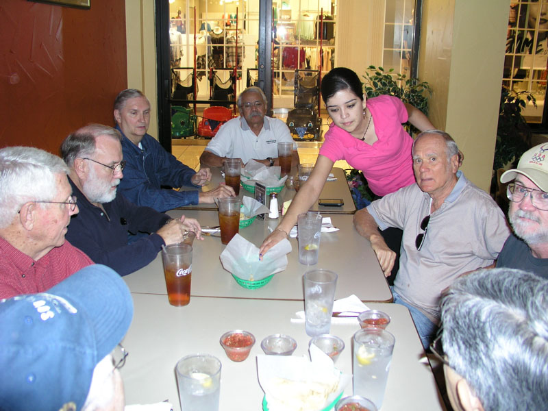 Clockwise starting with the blue cap: Harold Shiroma, Jim Rushing, Jerry Brown, George Huling, Mauricio Nuez, waitress, Mike Crye, Marvin Howard, Robert Everett 