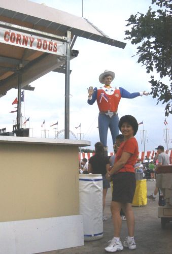 Angie contemplates a Fletcher's Corny Dog at the State Fair