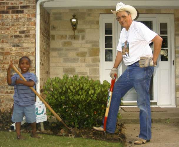 Clay and I take a break from cultivating the front flower beds