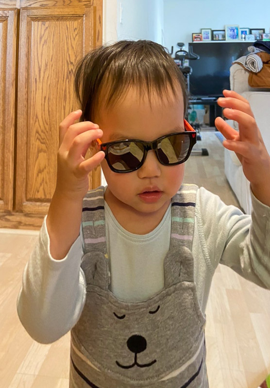 Lucas growing fast and looking like Joe Kool in his sunglasses