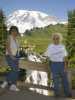 A small waterfall with Mt Rainier in the background