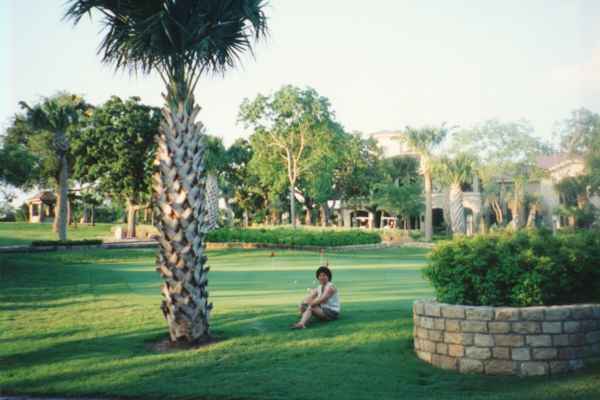 Angie relaxing in the shade in front Slick Rock Golf club