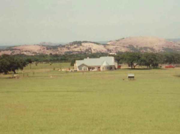Ranch house with Enchanted Rock in background